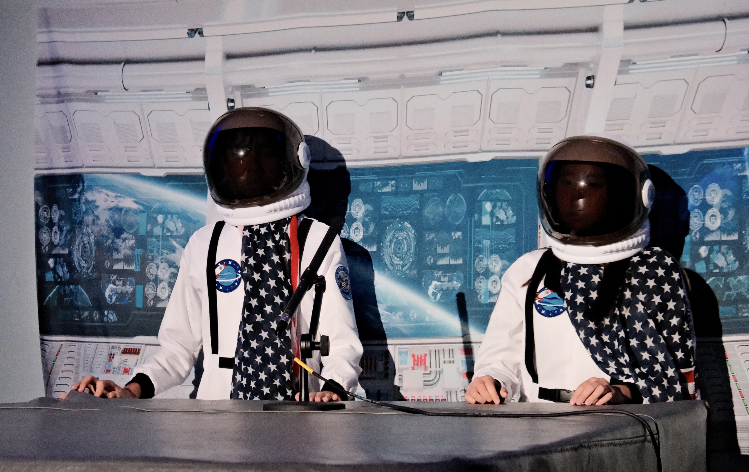 Astronauts at the control panel